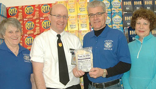 The Stewartville Kiwanis Club is co-sponsoring the 13th annual Food for Kidz food-packaging event for the poor at the Stewartville Civic Center on Saturday, April 9 from 10 a.m. to 4 p.m. Robert Hruska, grocery manager at Fareway of Stewartville, second from left, invites Fareway shoppers to donate to Food for Kidz at Fareway through February. Some of the Kiwanis Club members helping with the event include co-chairs Mary Brouillard, far left; and Todd Weston, second from right; along with Carol Youdas, far right.