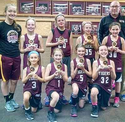 The Stewartville Youth Basketball Association fourth grade girls basketball team captured second place at the SYBA tournament on Jan. 24, defeating KM-Blue 45-17 and KM-White 30-8 before falling 14-12 to Byron in the championship game. Team members are, kneeling, from left, Katrina McClusky, McKenna O'Neill, Caitlyn Fenske, Savannah Hedin. Standing, from left, Coach Marie Rindahl, Arbor Weinhold, Lilly Beyer, Taylor Klement, Ayen DeCook, Coach Scott Rindahl. Not pictured, Meghan Urban.