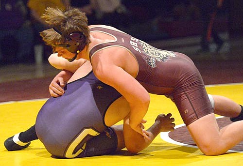 Adam Gehling hooks the left arm of his 220-pound opponent and drives him to his back.