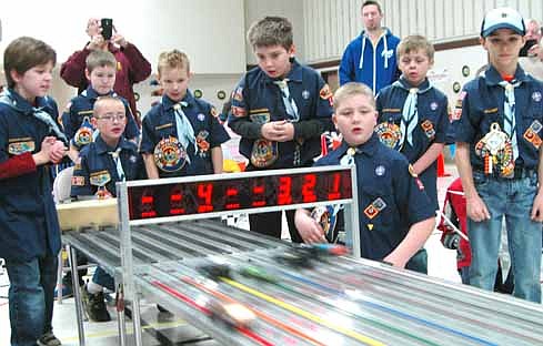 Stewartville Cub Scout Pack 156 took part in the annual Pinewood Derby at Grace Evangelical Free Church on Saturday, Jan. 23. Above, members of Den 2 watch their cars cross the finish line. Scouts include, from left, William Kundert, Marcus Johnson (standing), Jacob Eden (seated), Jack Field, William Kitzmann, Orrin Sanders, Mason Holtan and Aiden Schaefer.
