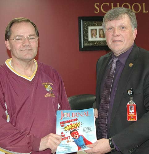 Rob Mathias, chairman of the Stewartville School Board, left, received the President's Award at the recent Minnesota School Boards Association (MSBA) State Conference for participating in more than 300 hours of school board training. Dr. David Thompson, superintendent of the Stewartville School District, right, congratulates Mathias.