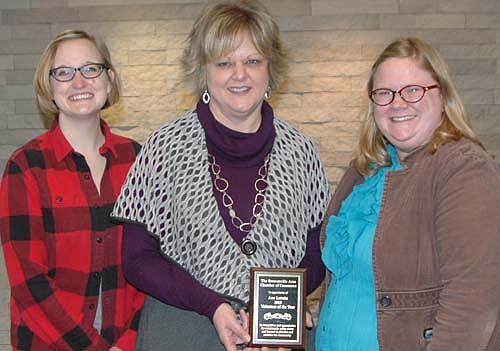 Ann Lutteke, center, accepts the Stewartville Area Chamber of Commerce Volunteer of the Year Award for 2015 from Melissa Sue Leuning, 2015 Chamber president, left; and Gwen Ravenhorst, Chamber administrator.