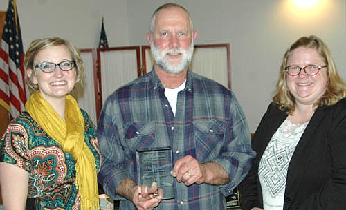Owen Sass, public works supervisor for the city of Stewartville, center, has received a special award for his work helping the Stewartville Area Chamber of Commerce prepare for its many local events. Melissa Sue Leuning, Chamber president, left, and Gwen Ravenhorst, Chamber administrator, presented the award at the Chamber's annual banquet at the Stewartville Civic Center on Saturday, Jan. 29. "Owen is incredible at his job, always thinking two or three steps ahead of what needs to be done," Leuning said. Sass plans to retire from his job with the city on June 30.