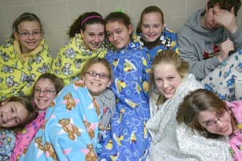BLANKETED IN FUN -- Students who made tie blankets during Stewartville Middle School's "cabin fever reliever" last week include, front row, from left, Kaitlyn Higgins, Emily Tompkins, Nia Gardner, Leah Onsgard and Sydney Quackenbush. Back row, from left, Rochelle Tagatz, Ashley Mietzner, Katie Scruggs, Katie Finley and Brigham Bethke. 