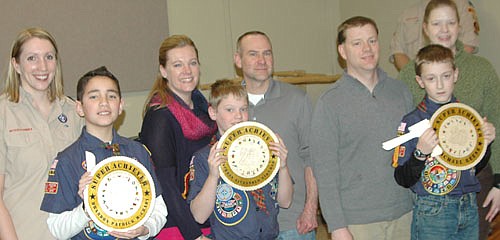 Three Webelo Scouts have received the Super Achiever Award for earning all 20 available pins during their time as a Webelo, including, for example, pins for craftsman, artist, geologist, scientist, athlete, citizen and showman, among many others. The award winners include, from left, Brandon McCrady, joined by his mother, Shelly; Jackson Struhar, accompanied by his parents, Alysia and Brett; and Ian Reese, along with his parents, Michael and Diana.