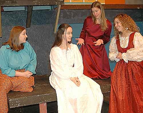 Juliet (Izzy Kramlinger), seated in center, listens as the residents of Verona offer marital advice during a dress rehearsal for Stewartville Community Theatre's upcoming production of Romeo & Juliet. Advisors include, from left, Juliet's nurse (Melissa Kloempken) Aunt Petra (RaeAnn Gotch)&#8200;and Mother, Lady Capulet (Kasey Kuker).