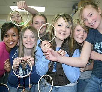 CATCHING DREAMS -- Seventh-graders who made dream catchers during Stewartville Middle School's "cabin fever reliever" last week include, from left, Brianna Buford, Autumn Kruse, Emily Nagel, Molly Lynch, Hannah Hohmeister, Jaidyn Boynton and Morgan Hettinger. 