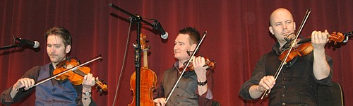 The Nordic Fiddlers Bloc, including, from left, Olav Luksengard Mjelva of Norway, Kevin Henderson of the Shetland Islands and Anders Hall of Sweden, presented a concert to a large group of students from Central Intermediate School at the Stewartville High School Performing Arts Center on Thursday, March 3.