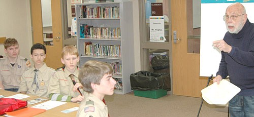 Richard Devlin, Olmsted County administrator, teaches citizenship in the community to a group of Boy Scouts at the 2016 Gamehaven Council Merit Badge Fair, held at Stewartville High School and Middle School on Saturday, March 19. Burkely Ravenhorst of Stewartville's Troop 56 is seated at far left.