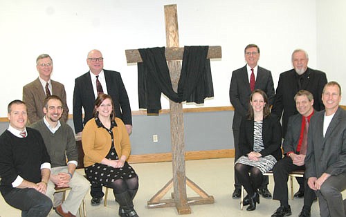 The Stewartville Ministerium hosted the annual Good Friday service at the Stewartville Civic Center on Friday, March 25. Pastors and others who participated included, front row, from left, Andrew Langseth, Grace Evangelical Free Church, Chad Skaran, Redemption Hill Church; Catie Levenick, Stewartville United Methodist Church; Kim Cassidy, Zion Lutheran Church; Kent Larson of Pleasant Grove Church of Christ, who provided the music; and Paul Langmade, Grace Evangelical Free Church. Back row, from left, Byron Meline, Zion Lutheran Church; Wane Souhrada, Stewartville United Methodist Church; Dr. John Grams, Grace Evangelical Free Church; and Dave Hoot, Stewartville Christian Church.