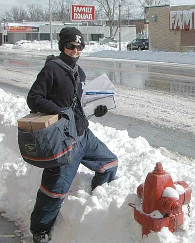 On Wednesday, March 23 and Thursday, March 24, an early-spring snowstorm dumped about 10.5 inches of snow on Stewartville and the area, making mail delivery more difficult for U.S. Postal Service carrier Jill Guy.