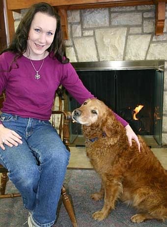 THE GIFT OF CALM -- Amy Lawson and Kellie, a trained therapy dog, make regular visits to the Stewartville Public Library and the Stewartville Care Center.  "It's really Kellie doing it," Lawson said. "I'm not the  center of attention." 