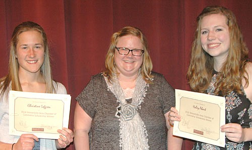 Chrissy Lofgren, left, and Haley Ahart, right, seniors at Stewartville High School, each received a $500 scholarship from the Stewartville Area Chamber of Commerce. Gwen Ravenhorst, Chamber administrator, center, presented the awards at the Chamber's Senior Appreciation Banquet on Wednesday evening, May 4.