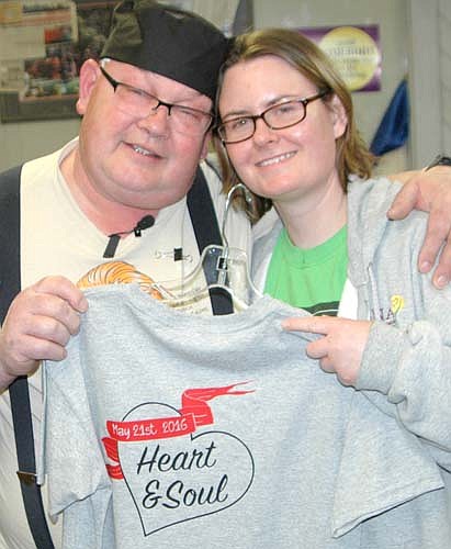 Martin Souhrada and daughter Jolene hold a sample of the T-shirt guests will wear at the Morning Lions benefit set for Saturday, May 21. Souhrada said he's looking forward to the benefit. "I'll say to the people, 'Come in, eat something, I'd love to talk to you,' " he said.