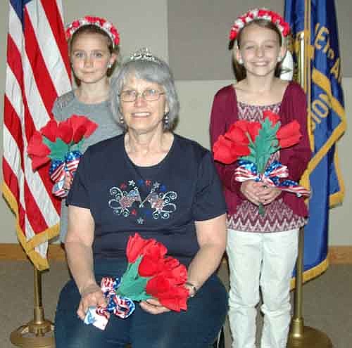 Sheila Majerus, seated, has been named the Stewartville American Legion Auxiliary Unit 164's poppy queen for 2016. Aubrey Frisch, left, and Autumn Wright, third graders, are this year's poppy princesses, selected based on their drawings for the annual poppy coloring contest. Majerus and the two princesses will ride in the Memorial Day Parade on Monday, May 30.
