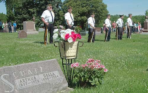Members of Stewartville's veterans organizations stand at attention during the annual Memorial Day ceremony at Woodlawn Cemetery on a warm and sunny Monday morning, May 30.
