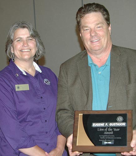 Gene Gustason, right, accepted the Stewartville Lions Club's Lion of the Year Award at the club's installation and awards program on Monday, June 6. Diane Tlougan, Zone 3 Lions chairperson, left, congratulated Gustason.