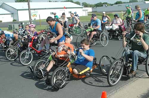 Participants in the annual Wheels and Heels of Fire 10K event get off to a good start on their way from Pizza Ranch to Ironwood Springs Christian Ranch on Saturday morning, June 11. About 75 campers took part in this year's 30th annual National Wheelchair Sports Camp.