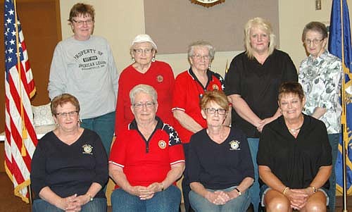 Pat Miner, first district president, standing in the center in back, installed new officers for 2016-17 for the Stewartville American Legion Auxiliary Unit 164 on Monday, June 20. Incoming officers include, front row, from left, Diane Ramaker, secretary; Audrey Farnsworth, second vice president and treasurer; Wanda Prescher, president; and Peggy Paulson, first vice president. Back row, from left, Theresa Santema, chaplain and historian; Donna Carlson, executive board member; Pat Miner;  and Laurel Jacobs and Carol Chihak, executive board members.