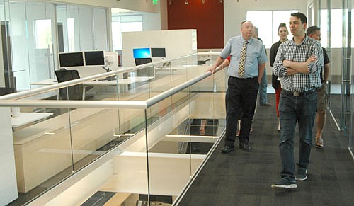 Ben Conway, president of Halcon, in foreground at right, led members of the Stewartville Economic Development Authority (EDA) on a tour of Halcon's new administration building on Tuesday, June 21. Bill Schimmel Jr., Stewartville's city administrator, stands at left.