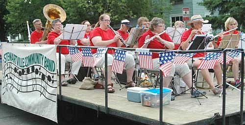 The Stewartville Community Band, all decked out in red, white and blue, plays some rousing tunes during the Summerfest Parade.