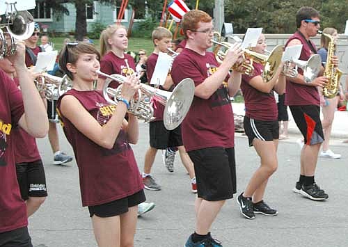 The Stewartville High School Band moves to the beat in front of a large audience during the annual Fourth of July Summerfest Parade.