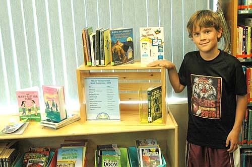 Nathan Jeche loves to visit the Stewartville Public Library. Last week, he took a close look at the library's newly reorganized section for young readers. "There are paperbacks in baskets, and the section features a new author each month," said Pat Johnson, library director.