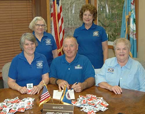 Mayor Jimmie-John King, front and center, signed a proclamation last week declaring Friday, Sept. 9 and Saturday, Sept. 10 Peanut Days&#8200;in the city of Stewartville. Kiwanis Club members involved in Peanut Days include, clockwise from left, Mary Brouillard, Janice Hagen, Carol Youdas and Iz Wilken.