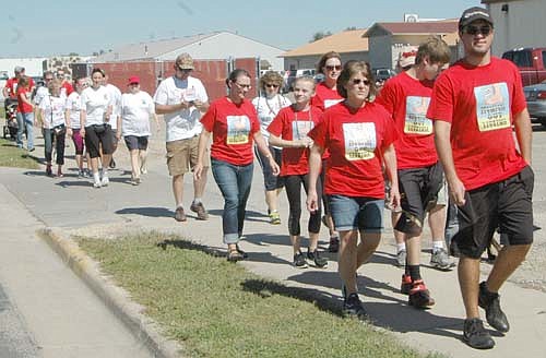 Participants at the fourth annual Seize the Day, Cure Blood Cancers begin their two-mile walk near the Stewartville American Legion Post 164 on Sunday afternoon, Sept. 11. Angie McGill and friends organize the event in memory of Angie's mother, Glenda Kollasch of Bancroft, Iowa, who died of leukemia in September 2012.