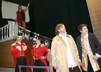 THERE IT IS! -- Squire Trelawney (Kevin Torgerson), far left in center, and Dr. Livesey (Kaysie Olson) feel confident they've found Treasure Island. Long John Silver (Jon Hyenga), at left in foreground, and Jim Hawkins (Alex Weston) strain to see as Billy Bones (Tom Sheffrey) points out the island from the crow's nest during a dress rehearsal for the Stewartville Community Theater production of "Treasure Island," which is scheduled to debut at the Stewartville High School PAC this Friday at 7:30 p.m.  