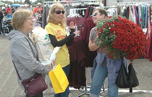 MUM'S THE WORD -- From left, Cheryl Fauver, Janelle Fistler and Nancy Kidd, all of Stewartville, gathered for a conversation at the Stewartville Morning Lions Club's annual Fall Festival on Saturday, Oct. 1. "I'm impressed," Fauver said about the festival. "It's huge compared to what it used to be.