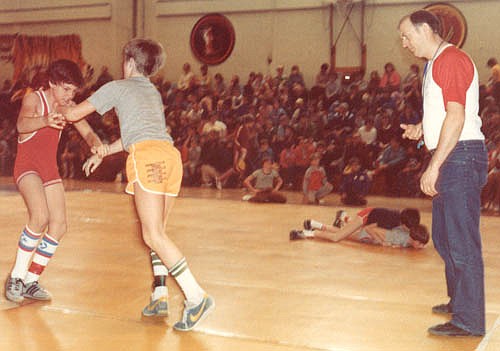 Carl Burns, above right, who was a very active early member of the Stewartville Wrestling Booster Club, officiates at a youth wrestling tournament in Stewartville in March 1983. Below, thanks to an AAU Cultural Exchange program, a German wrestling team visited Stewartville in February 1978.