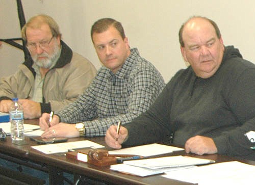 High Forest Township supervisors Kevin Wellik, far left, and Mark Manning, center, voted last week to deny developer Jessup DeCook's request to change the zoning for 36 acres of township land on which DeCook hoped to establish a sand and gravel mine.  Ken Oehlke, chair of the Township Board, right, dissented from the majority.
