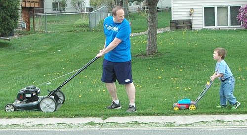 When John Omacht of Stewartville decided to mow his lawn on Monday, April 25, his son Chase, 4, wanted to help. Omacht, who lives at the 800 block of Fifth Avenue Southeast, says Chase loves to push his toy mower in his dad's footsteps.
