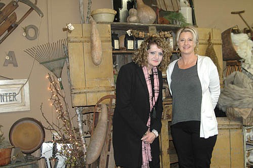 Lesa Welp, owner of The Rustic Bloom, right, with associate Cheryl Sonski, gives shoppers an opportunity to step back in time by offering items such as old cupboards, sinks, benches, farm items, flowers, plants, candles and more.