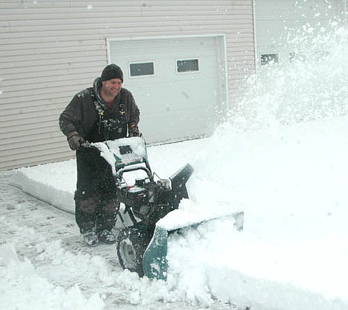 After a winter storm dumped about 11 inches of snow on Stewartville and the area, Craig Nagel went to work to clear the driveway at his business, Nagel Heating & Air Conditioning, last Wednesday morning, Jan. 25.
