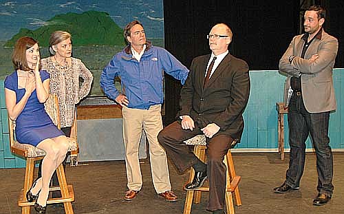 The chauffeur (Eldon Anderson), seated in the center, tries to explain how he became a millionaire to a skeptical family, including, from left, Sabrina (Rebecca Sands), Maude (Laurie Helmers), Linus (Randy Peterson) and David (Anthony Menz) during a dress rehearsal for Stewartville Community Theatre's upcoming preformance of Sabrina Fair, a modern-day version of Cinderella. The play, with a cast of 12 actors and actresses, will be presented at the Stewartville High School Performing Arts Center this Friday March 3 and Saturday, March 4 at 7:30 p.m. each evening, and on Sunday, March 5 at 2 p.m.