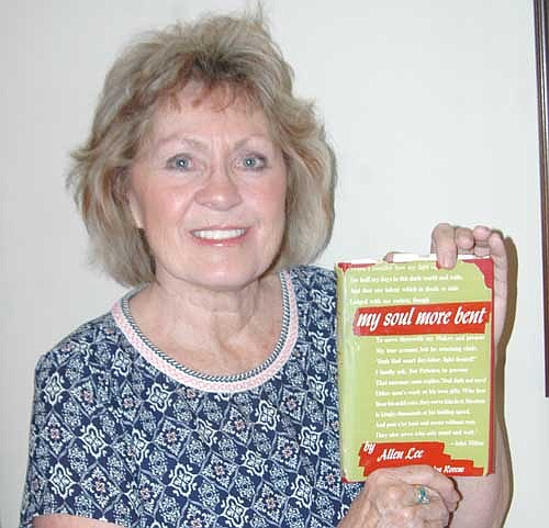 Judi Larsen displays her copy of My Soul More Bent, by Allen Lee. Roger Larsen, Judi's husband, bought the book at an estate auction in Hayfield about two years ago. Judy enjoyed the book. "I was very inspired,"&#8200;she said.