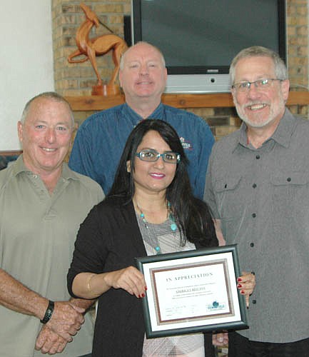 Nila Patel, co-owner of America's Best Inn, accepted the EDA's Business Appreciation Award last week from, clockwise from left, Mayor Jimmie-John King, a member of the EDA; Bill Schimmel Jr., city administrator, and Chris Stafford, EDA president.