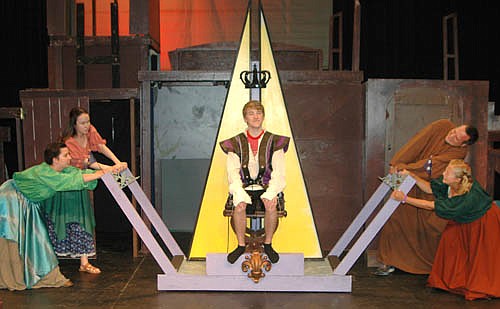The Gypsy King (Nathan Onsgard) rides while the work is done by his servants, from left, Paige Harne, Iz Kramlinger, Kelly Schrandt and Katie Eberhard, during a dress rehearsal for Stewartville Community Theatre's upcoming presentation of "The Hunchback of Notre Dame," to be presented at the Stewartville High School Performing Arts Center on Friday, Aug. 4 and Saturday, Aug. 5; Friday, Aug. 11 and Saturday, Aug. 12 at 7:30 p.m. each evening; and on Sunday, Aug. 13 at 2 p.m.  For more details, see the story that starts on the front page of today's STAR.