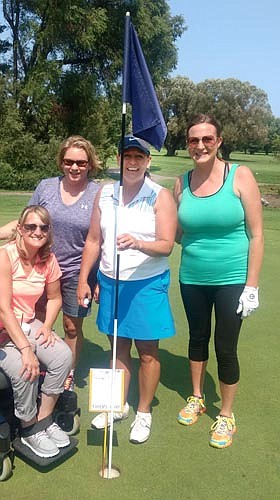 Sara Elton (holding pin) used an eight iron on the par three, 135-yard hole number 17 to score her first-ever hole-in-one at the SHS golf team fundraiser outing at Willow Creek Golf Course on Sunday, Aug. 20. Witnesses were Mary Nagel, Jenny Kahoun, Kylie Strum.