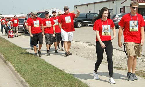 WALKIN' AND TALKIN' -- Participants at the fifth annual Seize the Day, Cure Blood Cancers, begin their two-mile walk near the Stewartville American Legion Post 164 on Sunday, Sept. 10. Seize the Day, Cure Blood Cancers raised about $5,000 this year.