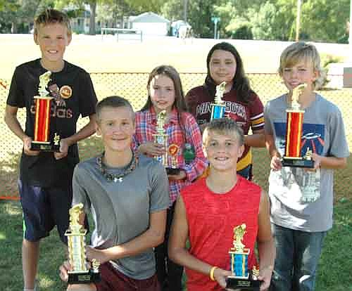 Winners in the Old Settlers Day Fishing Contest included, front row, from left, Isaac Larson, second place, game fish; and Ian Hoot, third place, rough fish. Back row, from left, Alex Hebl, first place, game fish; Eva Biffert, second place, rough fish; Littia Biffert, third place, rough fish; and Nathanael Biffert, first place, rough fish.