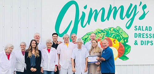 Mayor Jimmie-John King, far right, presents a certificate of appreciation to employees at Jimmy's Salad Dressings & Dips.