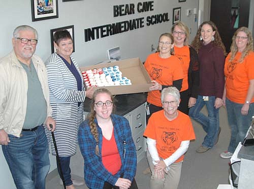 Members of the Stewartville American Legion Post 164 and Auxiliary Unit 164 celebrated American Education Week by delivering cupcakes to the staffs at all local schools last week, including the teachers and staff members at Bear Cave Intermediate School. Standing from left, Richard and Peggy Paulson, representing the Legion and Legion Auxiliary, deliver cupcakes to Bear Cave educators, from left, Brooke Hilger, paraprofessional; Joyce Jorde, Rose Steinman and Maryan Gisler, administrative assistants; along with Jen Nelson and Angie Kime, paraprofessionals.
