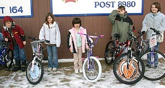 BICYCLE WINNERS -- Children who won bicycles in the Stewartville American Legion Post 164's and Legion Auxiliary Unit 164's annual Easter Egg Hunt on Saturday, March 22 included, Natalie Weber and Natalie Goetsch in the 0-2 age division, and Joel Davis and Mattison Gilbert in the 3-4 age division.  Winners in the older children's divisions, below, include, not necessarily in order, Kalie Pollay and Melia Hovey, 5-6; Cameron Argo and Kailee Brower, 7-8; and Quentin Wildeman and Katherine Engel, 9-10. 