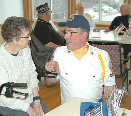 Dean Ramaker of the Stewartville American Legion Post 164, right, speaks with June Meyer, a resident of the Stewartville Care Center, during a Veterans Day program at the Care Center on Saturday, Nov. 11.