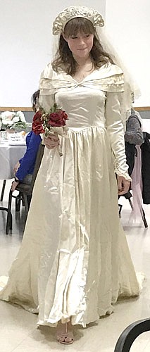 At the Tea & Luncheon, Sophie King models the wedding gown worn by her grandmother, Arlene King, in 1949.