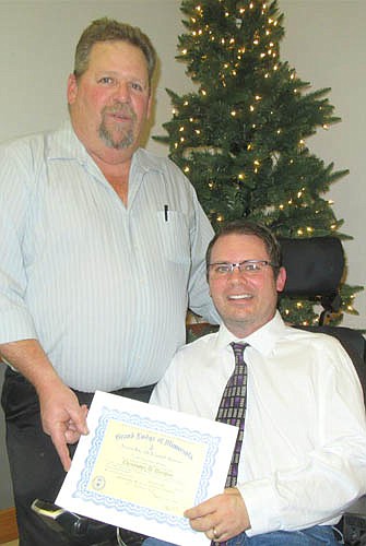 The Stewartville Masonic Lodge held its annual awards event at the Stewartville Civic Center on Tuesday evening, Dec. 12. Here, Chris Douglas, right, received a 25-year pin for his membership in the Lodge.