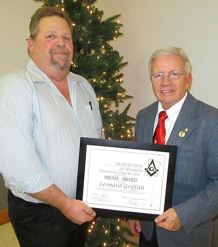 The Stewartville Masonic Lodge held its annual awards event at the Stewartville Civic Center on Tuesday evening, Dec. 12. Here, Len Griffith, right, accepts the Hiram Award from Worshipful Master Dale Clark. The Hiram Award is named for Hiram, recognized as the chief architect and builder of Solomon's temple. The award is given to a Masonic Lodge member who goes above and beyond the call of duty.